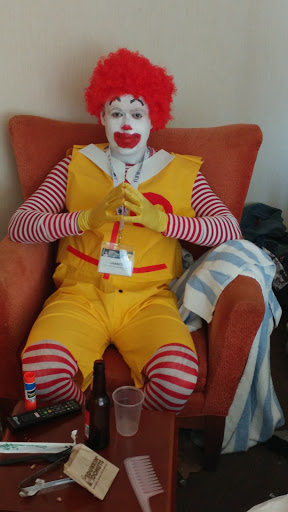 ronald mcdonald costume sitting